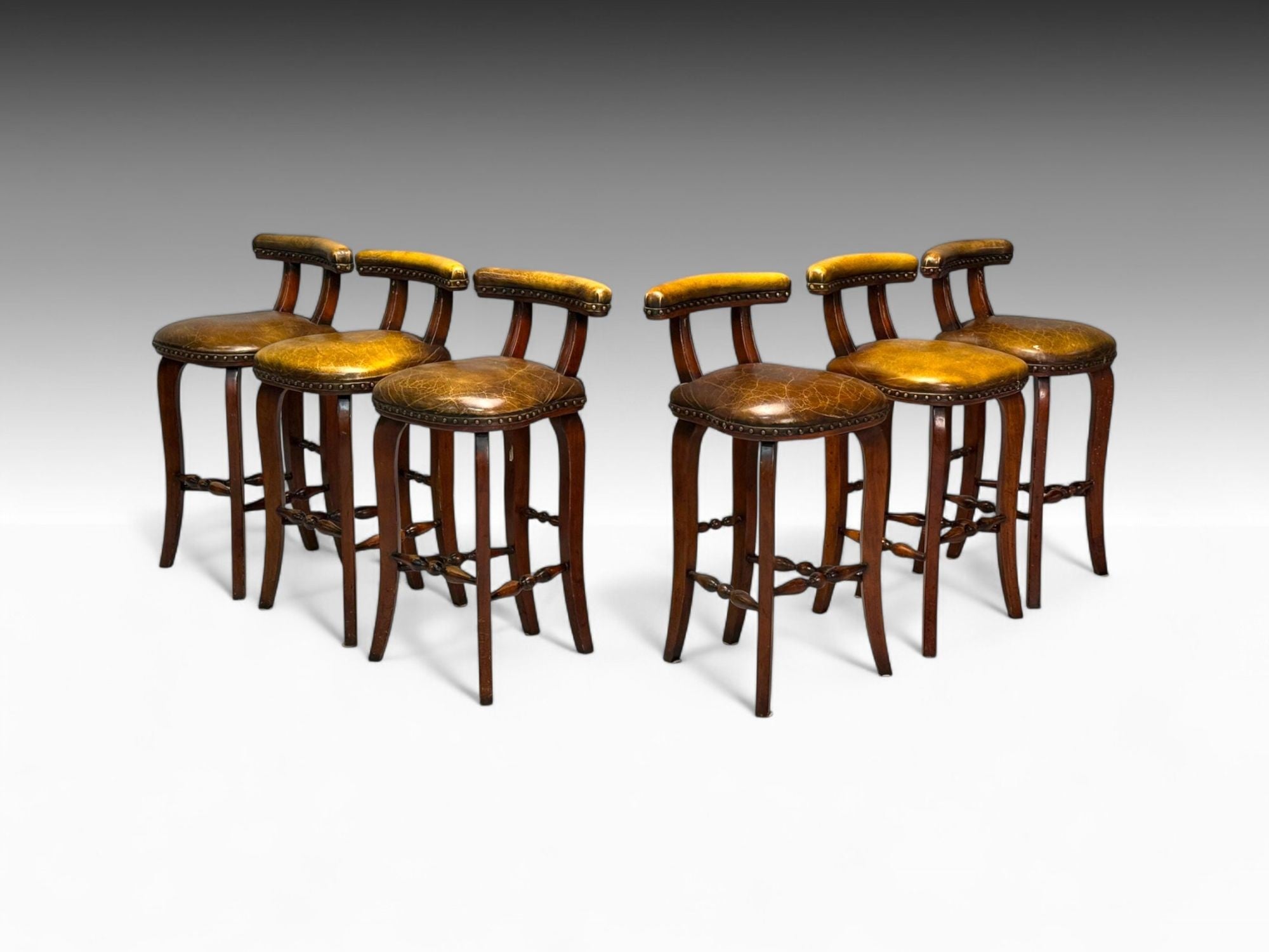 Georgian Style, Distressed Brown Leather, Stained Wood, Six Bar Stools, 20th C.