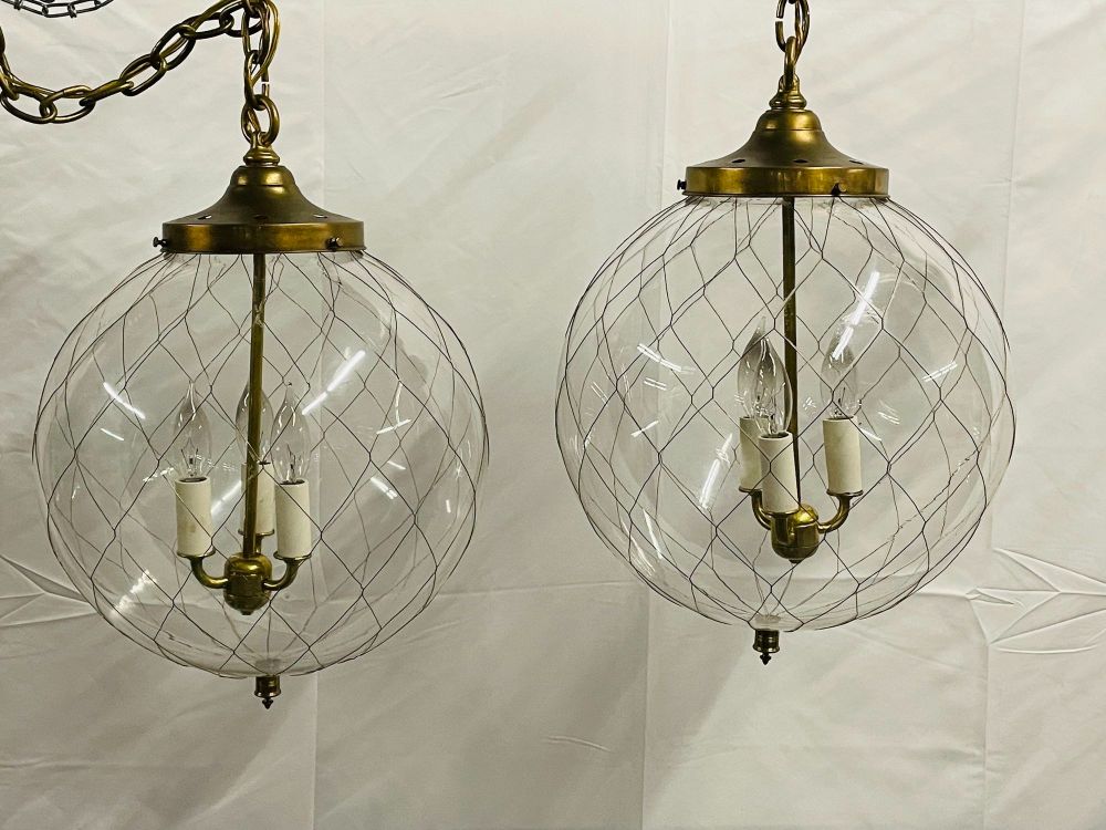 A Pair of Mid Century Modern Globe Pendants, Brass and Hand Blown Glass