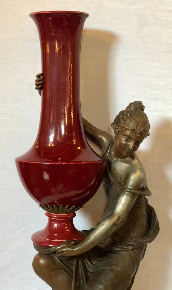 Spelter Figure of a Water Bearer on a Pedestal / Marble with Red Glazed Vase