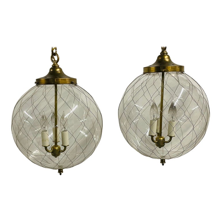 A Pair of Mid Century Modern Globe Pendants, Brass and Hand Blown Glass