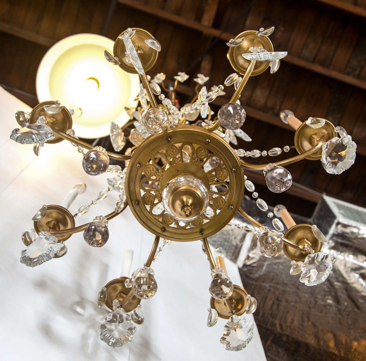 A Finely Cast Bronze and Crystal Eight Arm Chandelier