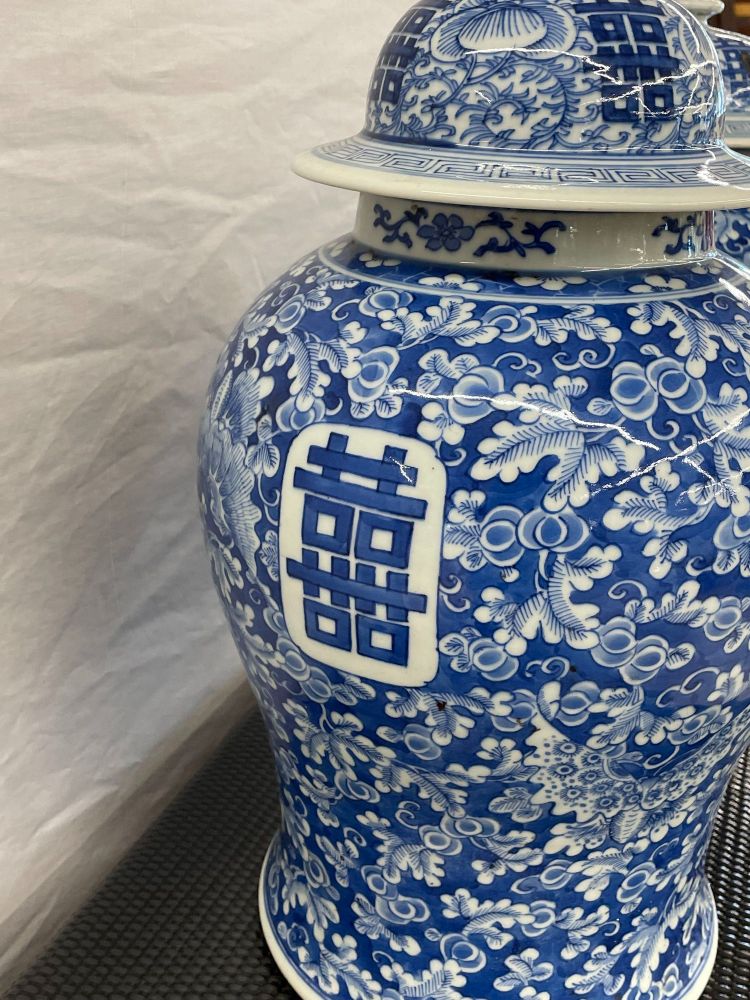 Pair of 19th Century Blue and White Lidded Temple Jars/Urns