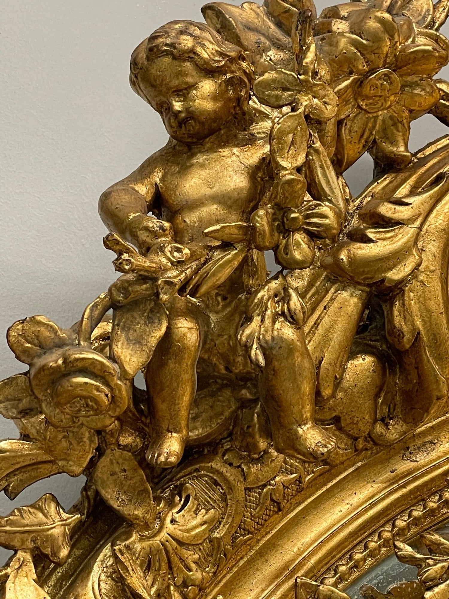 19th Century Palatial Giltwood Wall or Console Mirror Adorning Three Cherubs