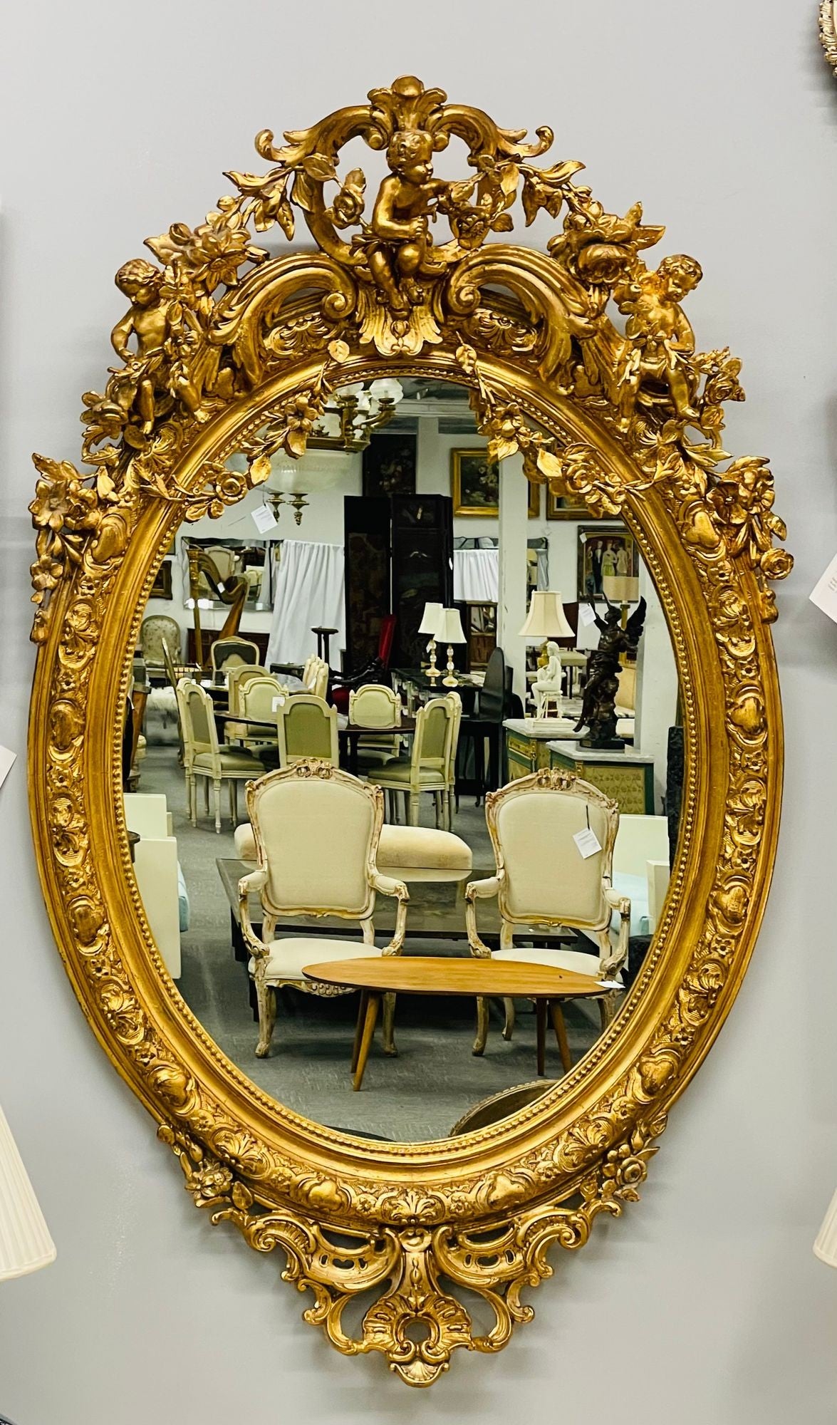 19th Century Palatial Giltwood Wall or Console Mirror Adorning Three Cherubs