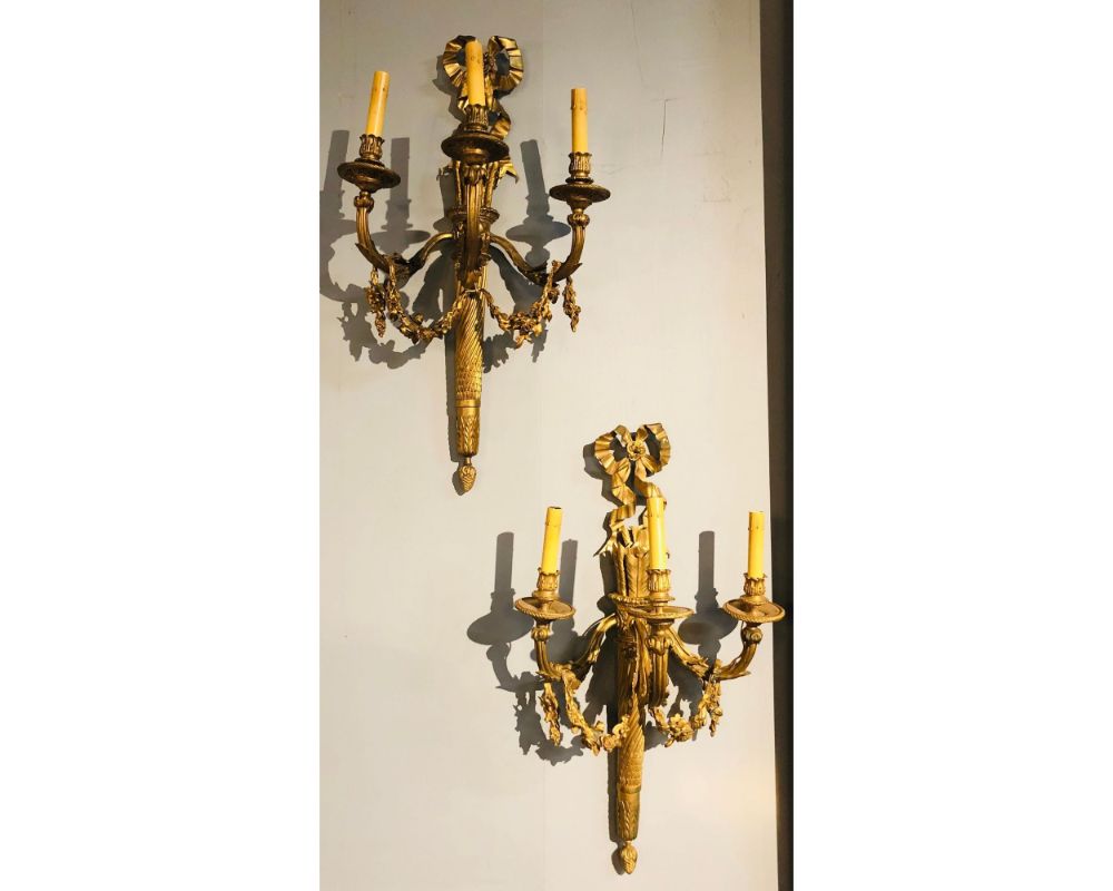Set of Four Large Ornate Three-Light Torch and Ribbon Form Wall Sconces