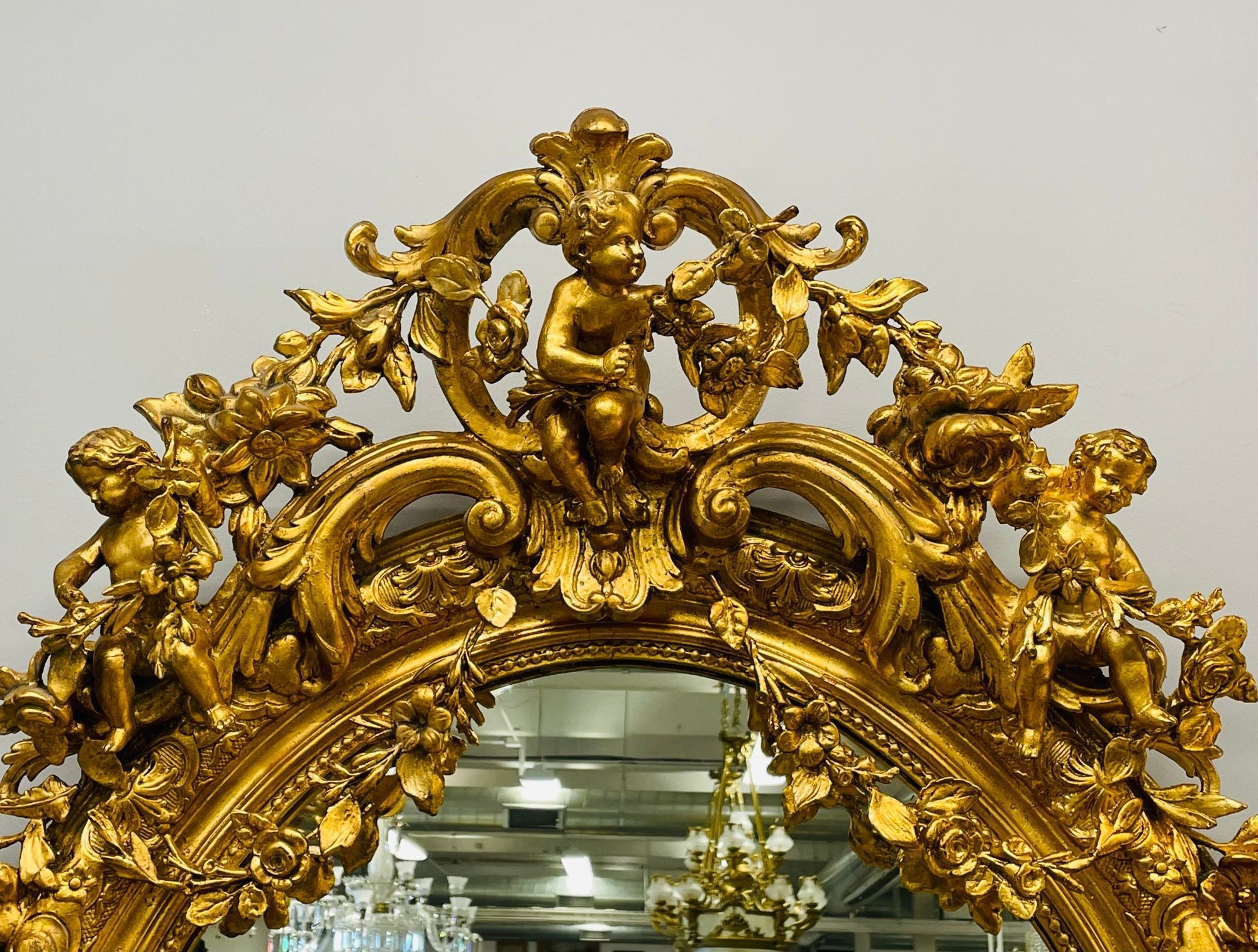 19th Century Palatial Giltwood Wall or Console Mirror Adorning Three Cherubs